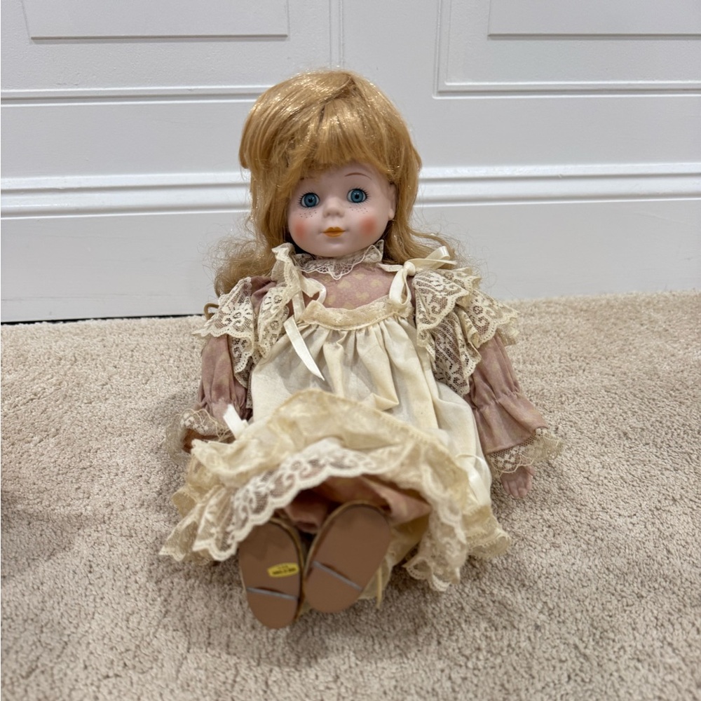 Vintage Style Porcelain Doll with Cream Dress